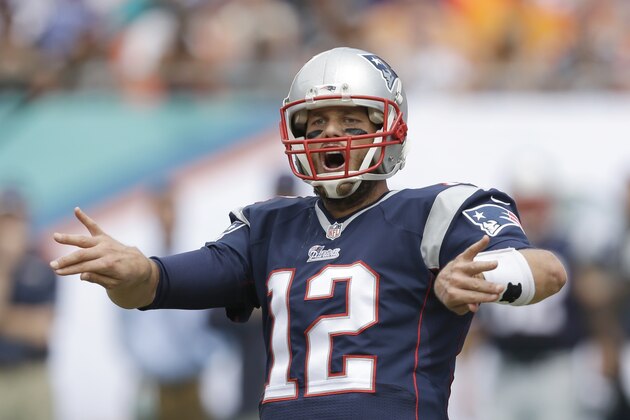 New England Patriots quarterback Tom Brady gestures during the first half of an NFL football game against the Miami Dolphins, Sunday, Sept. 7, 2014 in Miami Gardens, Fla. (AP Photo/Wilfredo Lee)