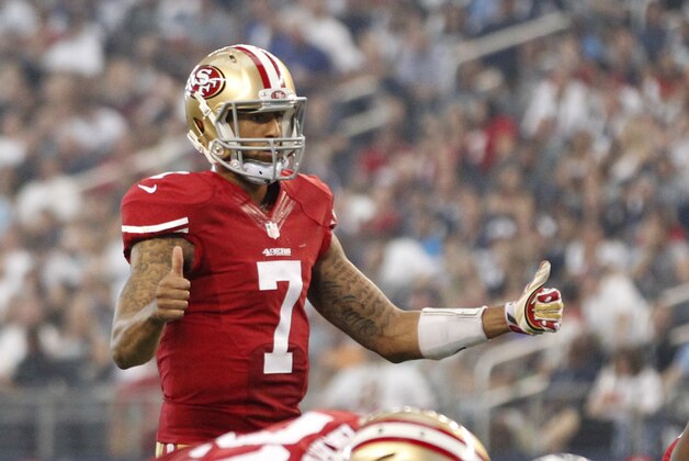 Sep 7, 2014; Arlington, TX, USA; San Francisco 49ers quarterback Colin Kaepernick (7) signals a play in the second quarter against the Dallas Cowboys  at AT&T Stadium. Mandatory Credit: Tim Heitman-USA TODAY Sports