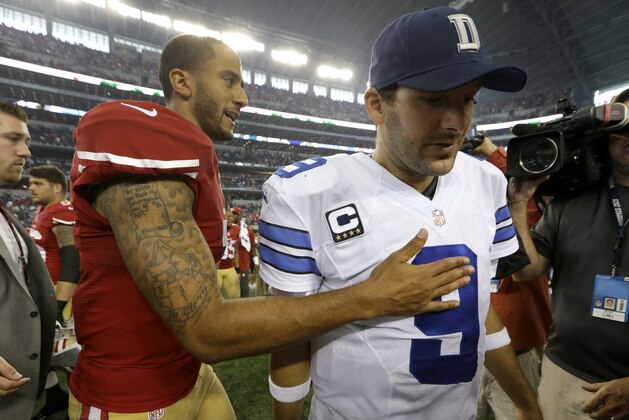San Francisco 49ers quarterback Colin Kaepernick taps Dallas Cowboys quarterback Tony Romo (9) on the chest after the two greeted each other on the field following their NFL football game, Sunday, Sept. 7, 2014, in Arlington, Texas. San Francisco won 28017.  (AP Photo/LM Otero)