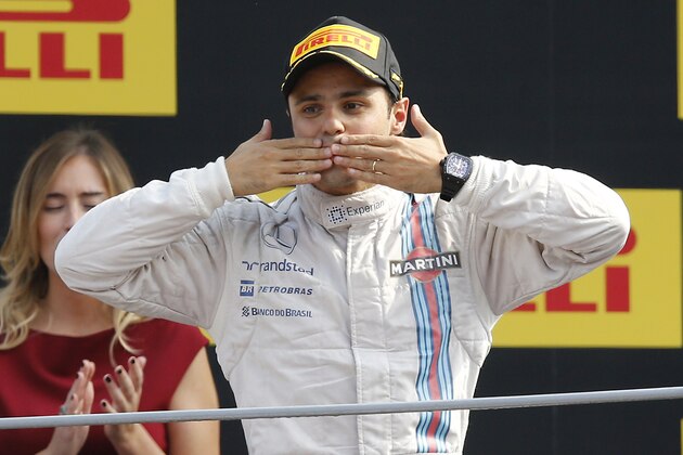 Williams driver Felipe Massa, of Brazil, celebrates on the podium after taking the third place in the Italian Formula One Grand Prix at the Monza racetrack, in Monza, Italy, Sunday, Sept. 7, 2014. (AP Photo/Antonio Calanni)