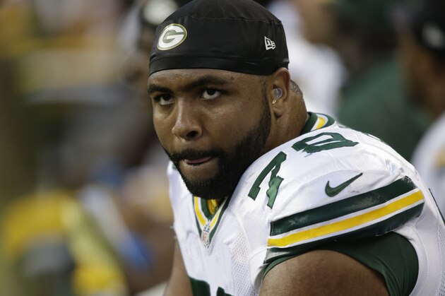 Green Bay Packers tackle Derek Sherrod looks toward the scoreboard while sitting on the sidelines in the second half of an NFL football game against the Seattle Seahawks, Thursday, Sept. 4, 2014, in Seattle. (AP Photo/Stephen Brashear)