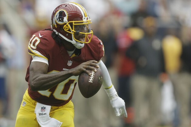 Washington Redskins quarterback Robert Griffin III (10) scrambles during the first quarter of an NFL football game Sunday, Sept. 7, 2014, in Houston. (AP Photo/Patric Schneider)