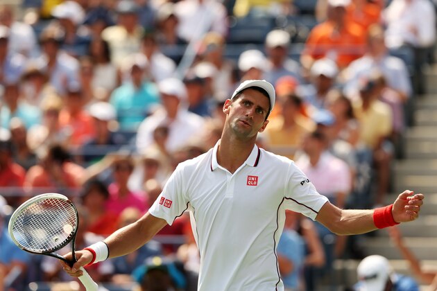 NEW YORK, NY - SEPTEMBER 06:  Novak Djokovic of Serbia reacts against Kei Nishikori of Japan during their men's singles semifinal match on Day Thirteen of the 2014 US Open at the USTA Billie Jean King National Tennis Center on September 6, 2014 in the Flushing neighborhood of the Queens borough of New York City.  (Photo by Matthew Stockman/Getty Images)