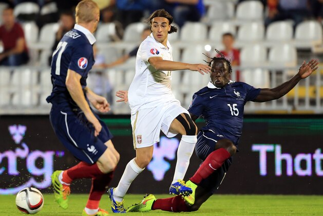 BELGRADE, SERBIA - SEPTEMBER 07: Lazar Markovic (C) of Serbia in action against Bacary Sagna (R) and Jeremy Mathieu (L) of France during the International friendly match between Serbia and France at the Stadium JNA on September 07, 2014 in Belgrade, Serbia, 2014. (Photo by Srdjan Stevanovic/Getty Images)