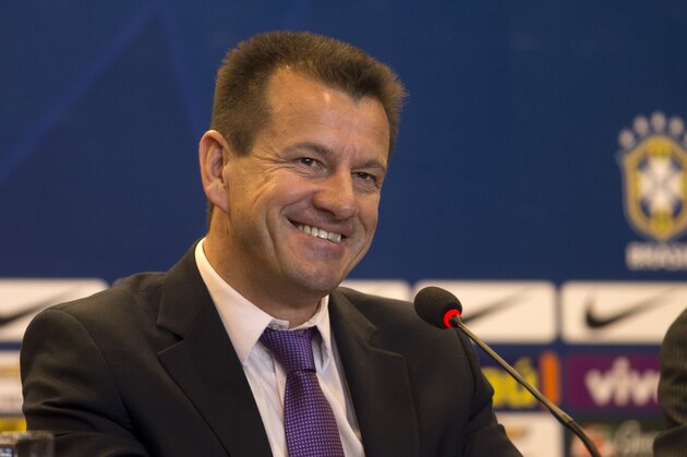 Brazil's soccer coach Dunga smiles during a press conference in Rio de Janeiro, Brazil, Tuesday, Aug. 19, 2014. Dunga summoned players for the upcoming friendly games against Colombia and Ecuador, the first time he picked players since taking over the national team from Luiz Felipe Scolari after the World Cup. (AP Photo/Silvia Izquierdo)
