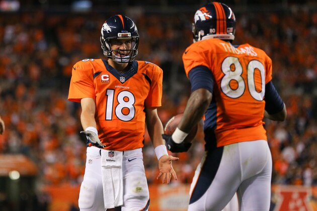 DENVER, CO - SEPTEMBER 7:  Quarterback Peyton Manning #18 of the Denver Broncos and tight end Julius Thomas #80 celebrate Thomas' third touchdown reception of the first half of a game at Sports Authority Field at Mile High on September 7, 2014 in Denver, Colorado.  (Photo by Justin Edmonds/Getty Images)
