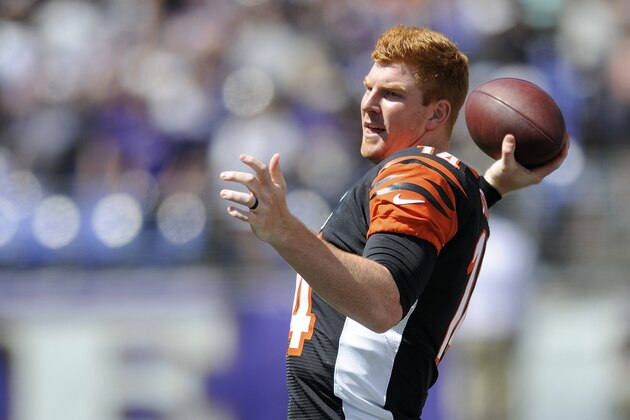 Cincinnati Bengals quarterback Andy Dalton (14) warms up before the first half of an NFL football game against the Baltimore Ravens in Baltimore, Md., Sunday, Sept. 7, 2014. (AP Photo/Gail Burton)