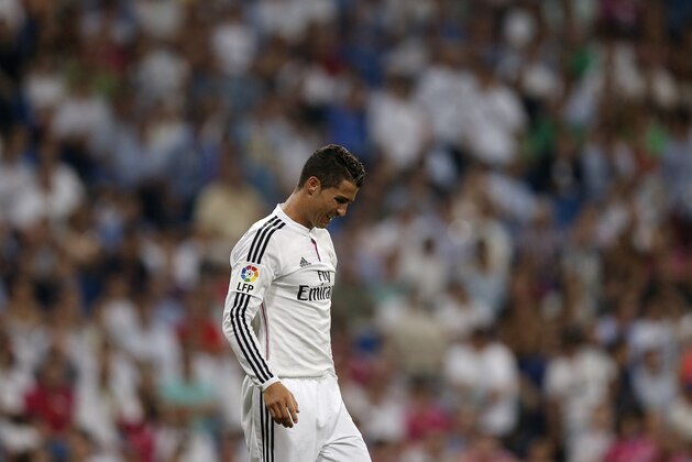 Real Madrid's Cristiano Ronaldo from Portugal reacts during a Spanish La Liga soccer match between Real Madrid and Cordoba at the Santiago Bernabeu stadium in Madrid, Spain, Monday, Aug. 25, 2014 . (AP Photo/Daniel Ochoa de Olza) Real Madrid's Cristiano Ronaldo from Portugal reacts during a Spanish La Liga soccer match between Real Madrid and Cordoba at the Santiago Bernabeu stadium in Madrid, Spain, Monday, Aug. 25, 2014 . (AP Photo/Daniel Ochoa de Olza)