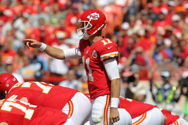 Kansas City Chiefs quarterback Alex Smith calls a play at the line of scrimmage in the second half of an NFL football game against the Tennessee Titans in Kansas City, Mo., Sunday, Sept. 7, 2014. (AP Photo/Ed Zurga)