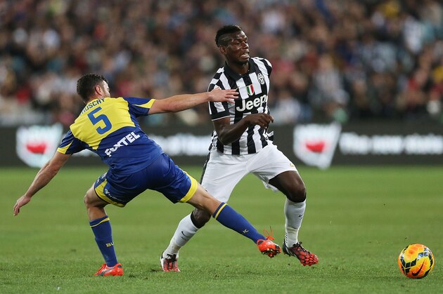 SYDNEY, AUSTRALIA - AUGUST 10:  Paul Pogba of Juventus takes on Manny Muscat of the All Stars during the match between the A-League All Stars and Juventus at ANZ Stadium on August 10, 2014 in Sydney, Australia.  (Photo by Mark Metcalfe/Getty Images)