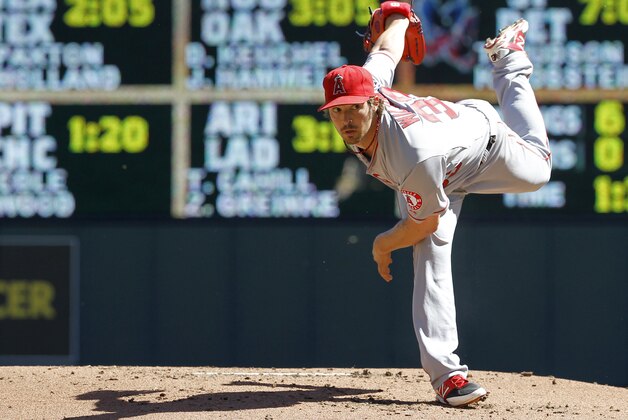 Los Angeles Angels starting pitcher C.J. Wilson follows through on a pitch during the first inning of a baseball game against the Minnesota Twins in Minneapolis, Sunday, Sept. 7, 2014. (AP Photo/Ann Heisenfelt)