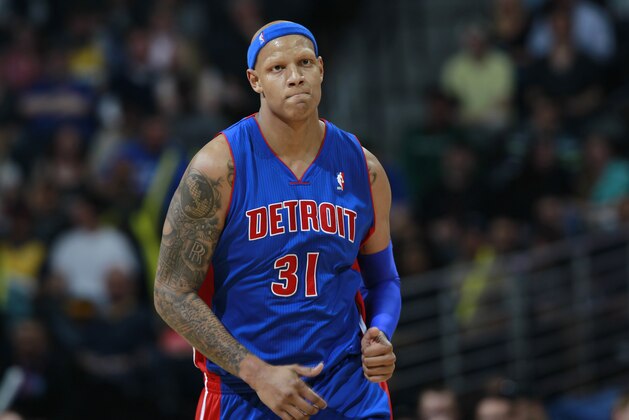 Detroit Pistons forward Charlie Viollanueva runs court against the Denver Nuggets in the fourth quarter of the Nuggets' 118-109 victory in an NBA basketball game in Denver on Wednesday, March 19, 2014. (AP Photo/David Zalubowski)