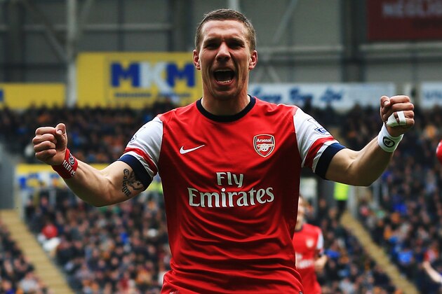 HULL, ENGLAND - APRIL 20:  Lukas Podolski of Arsenal celebrates scoring his sides third goal during the Barclays Premier League match between Hull City and Arsenal at KC Stadium on April 20, 2014 in Hull, England.  (Photo by Matthew Lewis/Getty Images)