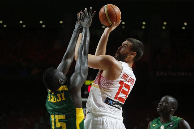 Spain's Marc Gasol shoots over Senegal's Abdou Badji during the Basketball World Cup  Round of 16 match between Spain and Senegal in Madrid, Spain, Saturday, Sept. 6, 2014. The 2014 Basketball World Cup competition will take place in various cities in Spain from Aug. 30 through to Sept. 14. (AP Photo/Andres Kudacki)