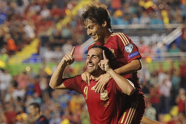 VALENCIA, SPAIN - SEPTEMBER 08: Paco Alcacer celebrates with David Silva after scoring Spain's 2nd goal during the UEFA EURO 2016 Group C Qualifier between Spain and FYR of Macedonia at Estadio Ciutat de Valencia on September 8, 2014 in Valencia, Spain.  (Photo by Denis Doyle/Getty Images)