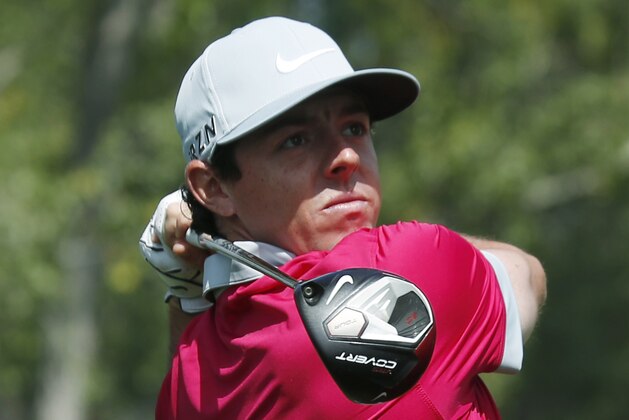 Rory McIlroy, of Northern Ireland, follows his shot off the second tee in the third round of the BMW Championship golf  tournament in Cherry Hills Village, Colo., Saturday, Sept. 6, 2014. (AP Photo/David Zalubowski)