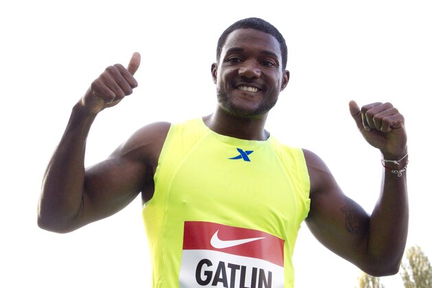 Justin Gatlin celebrates after winning the men’s 100 meters competition at the IAAF Grand Prix in Rieti, Italy, Sunday, Sept. 7, 2014. American sprinter Justin Gatlin finished the season undefeated by winning the 100 meters in 9.83 seconds at the IAAF world challenge meeting Sunday. (AP Photo/Alessandra Tarantino)