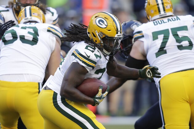 Green Bay Packers running back Eddie Lacy runs with the ball in the first half of an NFL football game against the Seattle Seahawks, Thursday, Sept. 4, 2014, in Seattle. (AP Photo/Stephen Brashear)