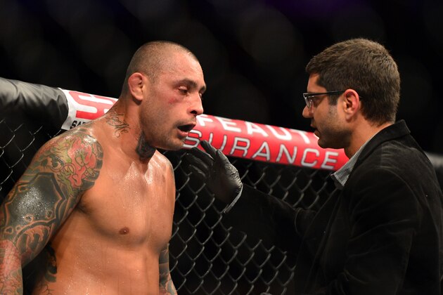 Oct 9, 2013; Barueri, Sao Paulo, Brazil; Thiago Silva (black shorts) is checked on during his fight against Matt Hamill (not pictured) during UFC Fight Night 29 at Jose Correa Arena. Mandatory Credit: Jason Silva-USA TODAY Sports