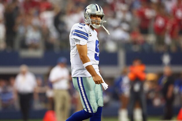 ARLINGTON, TX - SEPTEMBER 07:  Tony Romo #9 of the Dallas Cowboys walks off the field after throwing an interception against the San Francisco 49ers in the first quarter at AT&T Stadium on September 7, 2014 in Arlington, Texas.  (Photo by Ronald Martinez/Getty Images)