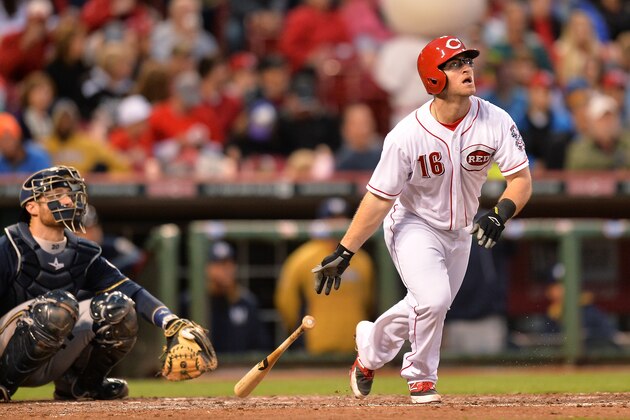 CINCINNATI, OH - MAY 1:  Tucker Barnhart #16 of the Cincinnati Reds watches his first major league home run sail over the right field wall in the fifth inning against the Milwaukee Brewers at Great American Ball Park on May 1, 2014 in Cincinnati, Ohio. Cincinnati defeated Milwaukee 8-3.  (Photo by Jamie Sabau/Getty Images)