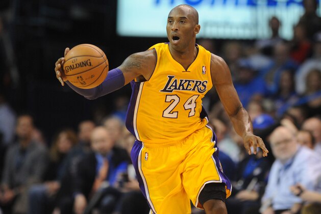Dec 13, 2013; Oklahoma City, OK, USA; Los Angeles Lakers shooting guard Kobe Bryant (24) dribbles the ball against the Oklahoma City Thunder during the second quarter at Chesapeake Energy Arena. Mandatory Credit: Mark D. Smith-USA TODAY Sports