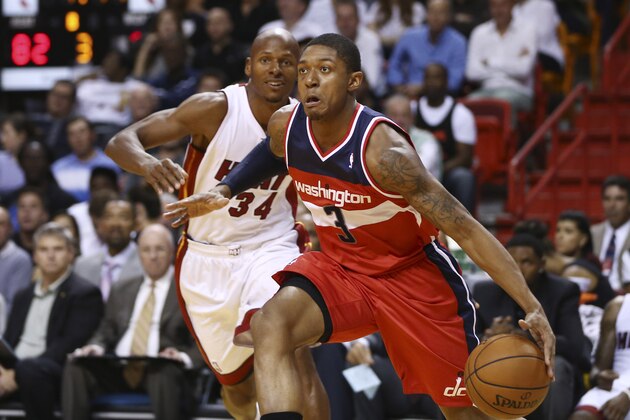 MIami Heat's Ray Allen (34) chases Washington Wizards' Bradley Beal (3) during the second half of an NBA basketball game in Miami, Sunday, Nov. 3, 2013. (AP Photo/J Pat Carter)