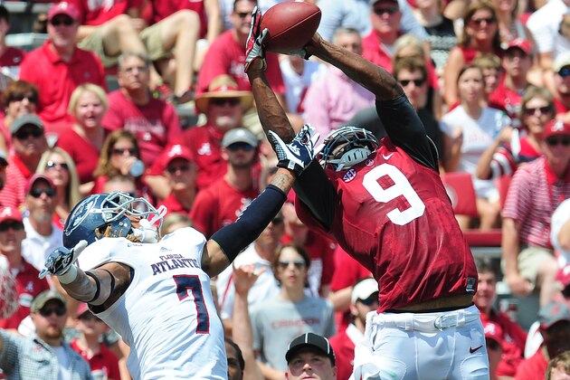 TUSCALOOSA, AL - SEPTEMBER 6: Amari Cooper #9 of the Alabama Crimson Tide goes up for a catch against Cre'von LeBlanc #7 of the Florida Atlantc Owls at Bryant-Denny Stadium on September 6, 2014 in Tuscaloosa, Alabama. (Photo by Scott Cunningham/Getty Images)