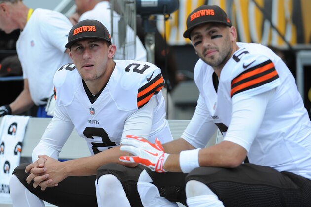 Cleveland Browns quarterbacks Johnny Manziel (2) and Brian Hoyer sit on the bench during the NFL football game against the Pittsburgh Steelers on Sunday, Sept. 7, 2014 in Pittsburgh. (AP Photo/Don Wright)