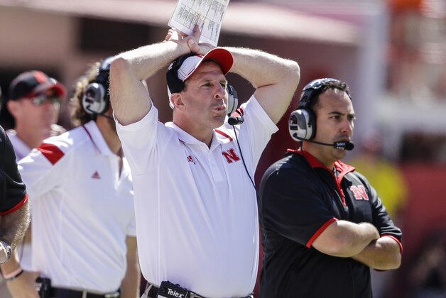 Nebraska head coach Bo Pelini holds his head while watching a replay on a big screen in the second half of an NCAA college football game against McNeese State in Lincoln, Neb., Saturday, Sept. 6, 2014. Nebraska won 31-24. (AP Photo/Nati Harnik)