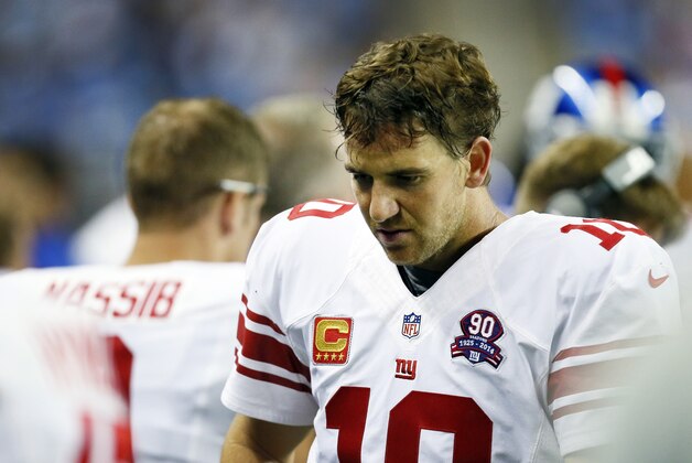 New York Giants quarterback Eli Manning is seen on the sidelines during the second quarter of an NFL football game against the Detroit Lions in Detroit, Monday, Sept. 8, 2014. (AP Photo/Paul Sancya)