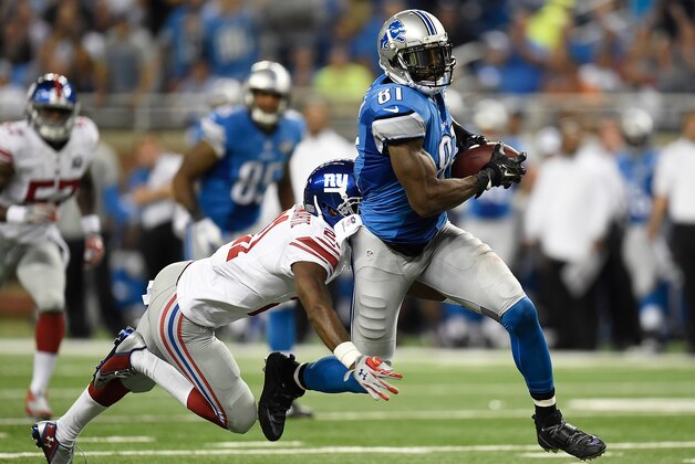 DETROIT, MI - SEPTEMBER 08:  Calvin Johnson #81 of the Detroit Lions is tackled by Dominique Rodgers-Cromartie #21 of the New York Giants during the second quarter at Ford Field on September 8, 2014 in Detroit, Michigan. (Photo by Joe Sargent/Getty Images)