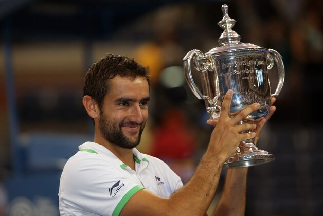 Marin Cilic, of Croatia, holds his trophy after defeating Kei Nishikori, of Japan, for the championship of the 2014 U.S. Open tennis tournament, Monday, Sept. 8, 2014, in New York. (AP Photo/Mike Groll)