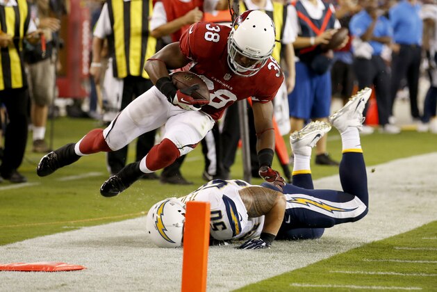 Arizona Cardinals running back Andre Ellington (38) is tackled by San Diego Chargers outside linebacker Melvin Ingram during the first half of an NFL football game, Monday, Sept. 8, 2014, in Glendale, Ariz. (AP Photo/Ross D. Franklin)