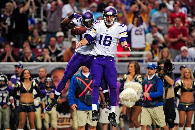 Sep 7, 2014; St. Louis, MO, USA; Minnesota Vikings wide receiver Greg Jennings (15) and quarterback Matt Cassel (16) celebrate after an 8-yard touchdown during the first half against the St. Louis Rams at the Edward Jones Dome. Mandatory Credit: Jeff Curry-USA TODAY Sports
