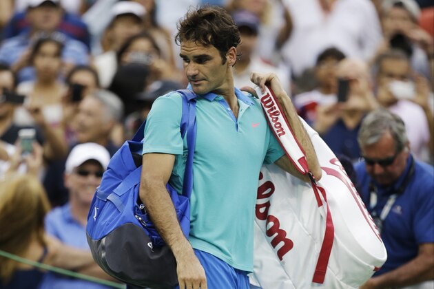 Roger Federer, of Switzerland, walks off the court after losing to Marin Cilic, of Croatia, during the semifinals of the 2014 U.S. Open tennis tournament, Saturday, Sept. 6, 2014, in New York. (AP Photo/Darron Cummings)
