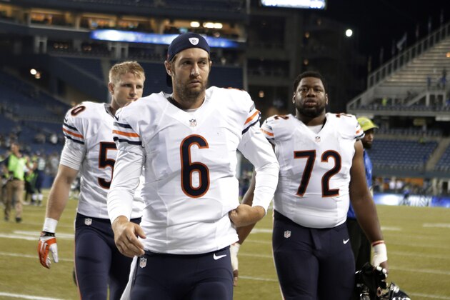 Chicago Bears quarterback Jay Cutler (6) and teammates Shea McClellin and Charles Leno (72) walk off the field after a preseason NFL football game, Friday, Aug. 22, 2014, in Seattle. The Seahawks won 34-6. (AP Photo/Stephen Brashear)