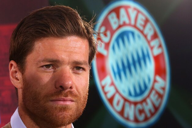 New Munich player, Xabi Alonso from Spain ,   poses  during a press conference at  the club's  headquarter   in Munich, Germany, Monday Sept.1, 2014. (AP Photo/ Alexander Hassenstein,Pool)
