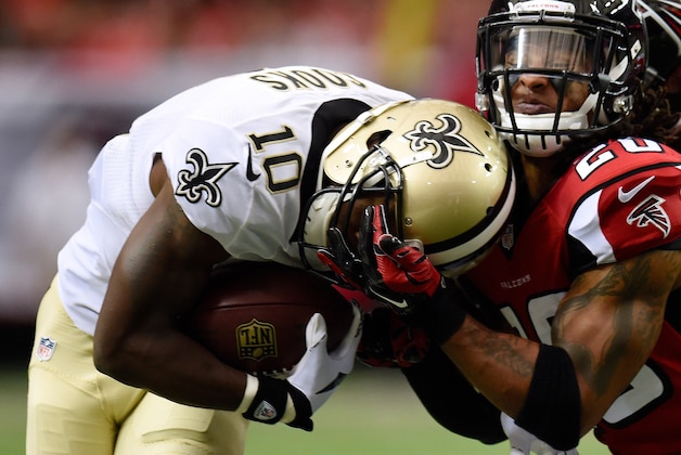 Sep 7, 2014; Atlanta, GA, USA; New Orleans Saints wide receiver Brandin Cooks (10) is tackled by Atlanta Falcons free safety Dwight Lowery (20) during the first quarter at the Georgia Dome. Mandatory Credit: Dale Zanine-USA TODAY Sports