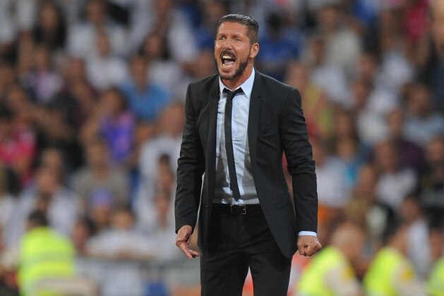 MADRID, SPAIN - AUGUST 19:  Head coach Diego Simeone of Club Atletico de Madrid looks on during the Supercopa first leg match between Real Madrid and Club Atletico de Madrid     at Estadio Santiago Bernabeu on August 19, 2014 in Madrid, Spain.  (Photo by Denis Doyle/Getty Images)