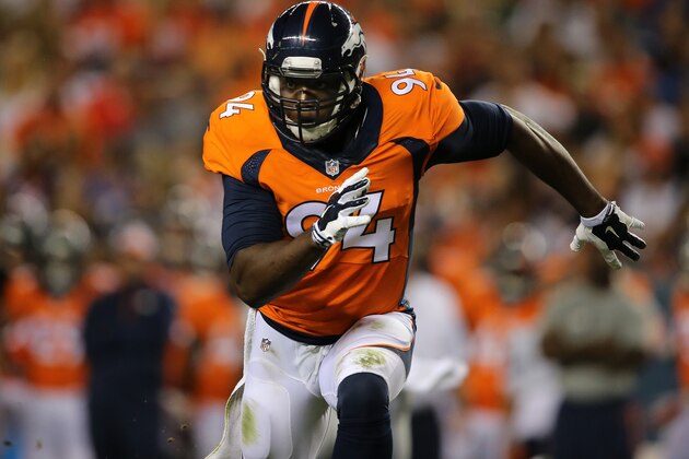 DENVER, CO - AUGUST 07:  Defensive end DeMarcus Ware #94 of the Denver Broncos rushes against the Seattle Seahawks during preseason action at Sports Authority Field at Mile High on August 7, 2014 in Denver, Colorado. The Broncos defeated the Seahawks 21-16.  (Photo by Doug Pensinger/Getty Images)