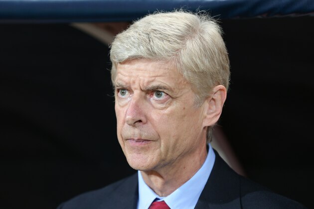 Arsenal's coach Arsene Wenger watches the game during their Champions League play-off first leg soccer match with Besiktas in Istanbul, Turkey, Tuesday, Aug. 19, 2014. (AP Photo)