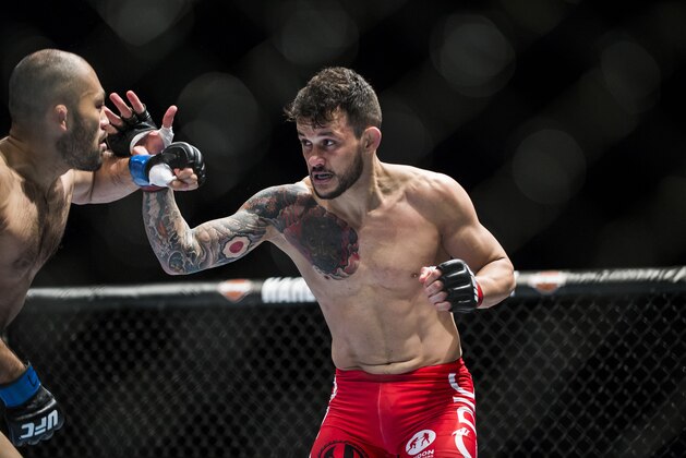 MACAU 2:, MACAU 2: - AUGUST 23:  MACAU 2:, MACAU 2: - AUGUST 23:  Alberto Mina (R) of Brazil and Shinsho Anzai of Japan in action on their welterweight fight during the UFC Fight Night at The Venetian Macao Cotai Arena on August 23, 2014 in Macau, China.  (Photo by Victor Fraile/Getty Images)