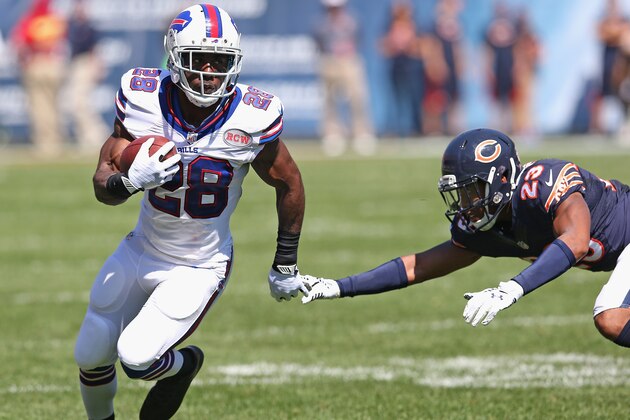 CHICAGO, IL - SEPTEMBER 07:  C.J. Spiller #28 of the Buffalo Bills runs past  Kyle Fuller #23 of the Chicago Bears during the first half at Soldier Field on September 7, 2014 in Chicago, Illinois.  The Bills defeated the Bears 23-20 in overtime. (Photo by Jonathan Daniel/Getty Images)