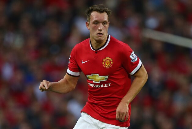 MANCHESTER, ENGLAND - AUGUST 12: Phil Jones of Manchester United in action during the Pre Season Friendly match between Manchester United and Valencia at Old Trafford on August 12, 2014 in Manchester, England.  (Photo by Clive Brunskill/Getty Images)