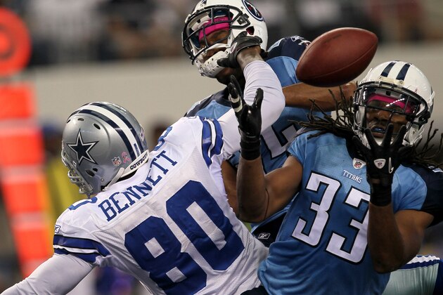 ARLINGTON, TX - OCTOBER 10:  Safety Michael Griffin #33 of the Tennessee Titans makes an interception in the end zone over tight end Martellus Bennett #80 of the Dallas Cowboys at Cowboys Stadium on October 10, 2010 in Arlington, Texas.   The Titans won 34-27.  (Photo by Stephen Dunn/Getty Images)