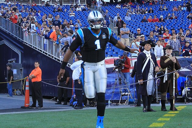 FOXBORO, MA - AUGUST 22:  Cam Newton #1 of the Carolina Panthers runs onto the field before a preseason game with the New England Patriots at Gillette Stadium on August 22, 2014 in Foxboro, Massachusetts. (Photo by Jim Rogash/Getty Images)