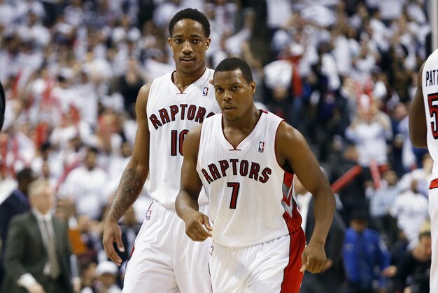 Apr 30, 2014; Toronto, Ontario, CAN; Toronto Raptors guard DeMar DeRozan (10) and guard Kyle Lowry (7) come off the court during a break in the action against the Brooklyn Nets in game five of the first round of the 2014 NBA Playoffs at the Air Canada Centre. Toronto defeated Brooklyn 115-113. Mandatory Credit: John E. Sokolowski-USA TODAY Sports