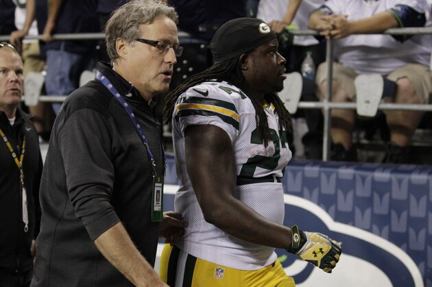Green Bay Packers running back Eddie Lacy, right, walks off the field with a trainer in the second half of an NFL football game against the Seattle Seahawks, Thursday, Sept. 4, 2014, in Seattle. (AP Photo/Stephen Brashear)