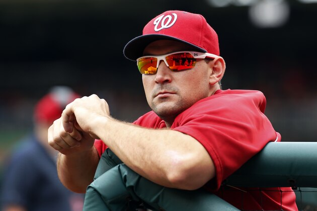 Washington Nationals left fielder Ryan Zimmerman rests in the dugout before a baseball game against the Philadelphia Phillies at Nationals Park Sunday, Aug. 3, 2014, in Washington. (AP Photo/Alex Brandon)